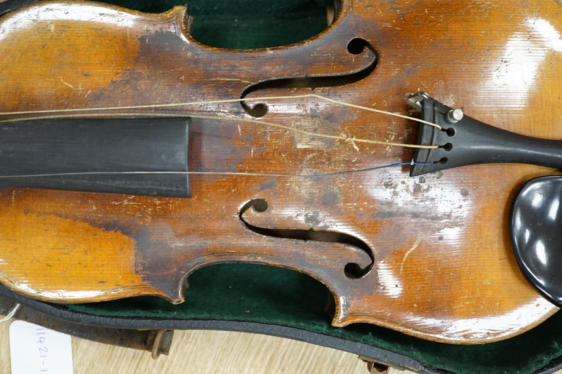 A cased 19th century Continental violin with lions head carved scroll, length of body, 35.5cm, with bow CITES Submission reference T5V8RCZY